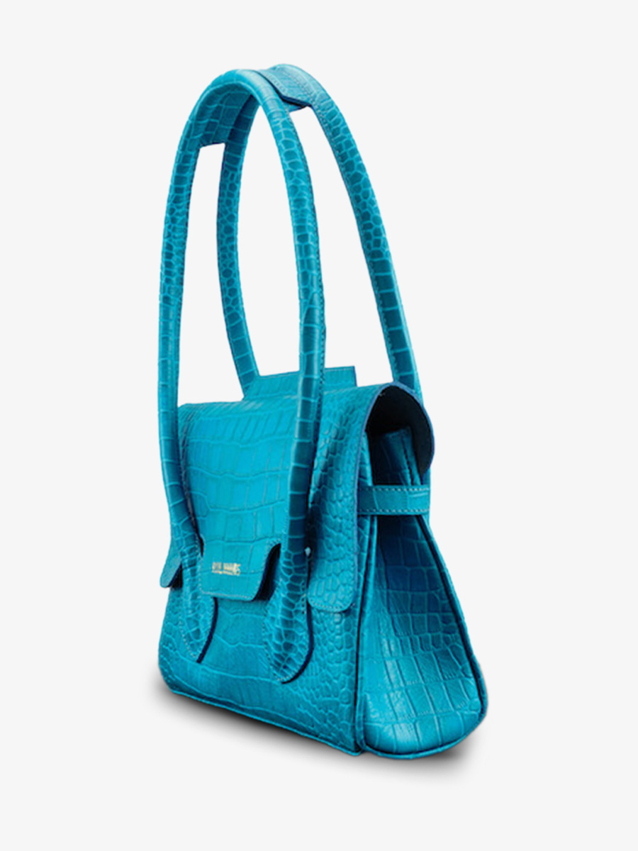 photo-vue-de-cote-sac-a-main-cuir-femme-bleu-colette-s-alligator-cocktail-topaze-paul-marius-w28s-a-blu